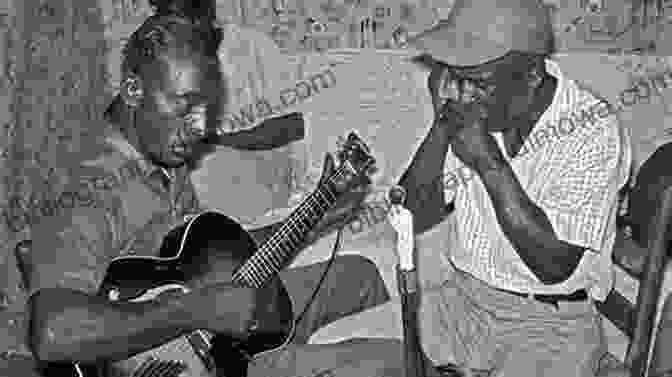 Black And White Image Of Blues Musicians Playing The Guitar And Harmonica On A Porch Wayfaring Stranger: A Musical Journey In The American South